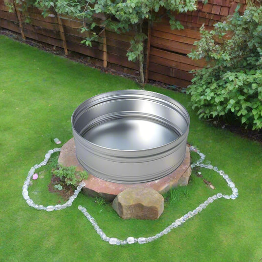 3ft round ice bath stock tank in a garden