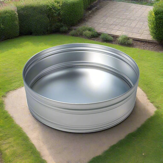 6ft round ice bath steel tank in a garden