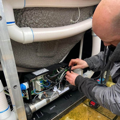 Engineer cleaning out the hot tub for shut down